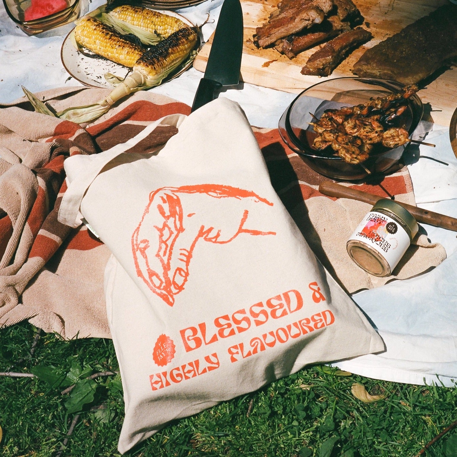 Tote bag at summer picnic BBQ with shrimp ribs and corn on the cob